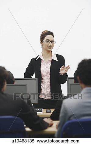 Stock Photography - Businesswoman giving a presentation. Fotosearch