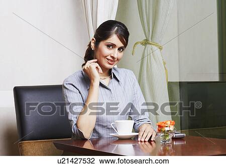 Stock Image - Portrait of a businesswoman smiling. Fotosearch
