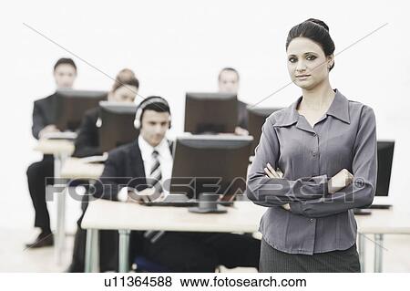 Portrait of a businesswoman standing in an office View Large Photo Image Stock Photo - Portrait of a businesswoman standing in an office. Fotosearch