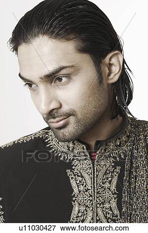 Stock Photo - Close-up of a young man in traditional clothing. Fotosearch