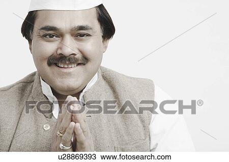 Stock Image - Portrait of a male politician greeting. Fotosearch