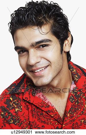 Stock Image - Portrait of a young man smiling. Fotosearch