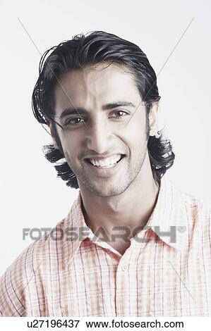 Portrait of a young man smiling View Large Photo Image Stock Photo - Portrait of a young man smiling. Fotosearch