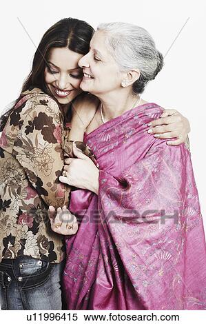 Stock Photography - Close-up of a girl and her grandmother smiling. Fotosearch