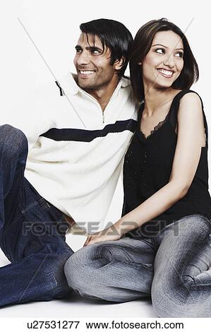 Stock Photo - Close-up of a young couple smiling. Fotosearch