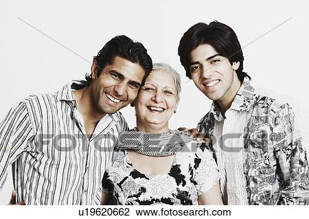 Portrait of a mature woman smiling with her two grandsons View Large Photo Image Stock Image - Portrait of a mature woman smiling with her two grandsons. Fotosearch