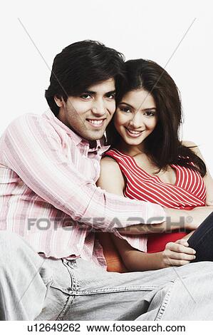 Portrait of a young couple smiling View Large Photo Image Stock Image - Portrait of a young couple smiling. Fotosearch