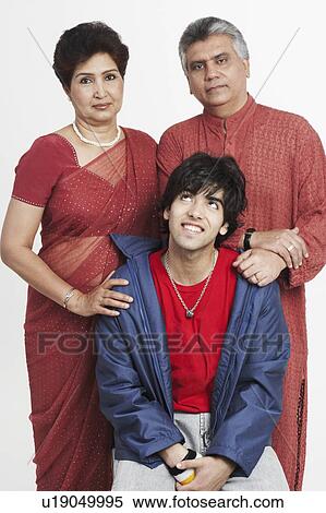 Portrait of parents and their son smiling View Large Photo Image Stock Photography - Portrait of parents and their son smiling. Fotosearch