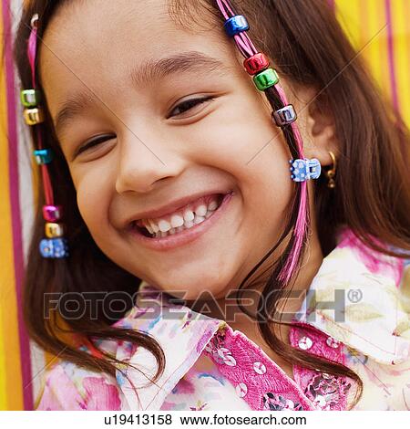 Stock Photo - Close-up of a girl smiling. Fotosearch