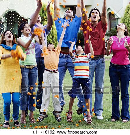 Group of people tossing flowers View Large Photo Image Stock Image - Group of people tossing flowers. Fotosearch