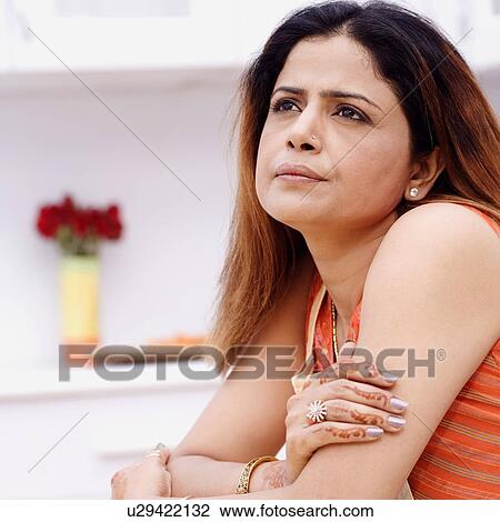 Side profile of a mid adult woman thinking View Large Photo Image Stock Image - Side profile of a mid adult woman thinking. Fotosearch