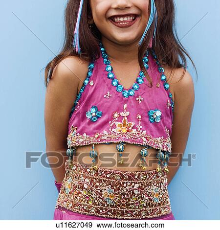 Close-up of a girl smiling View Large Photo Image Stock Photo - Close-up of a girl smiling. Fotosearch