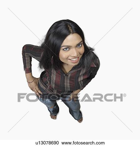 Stock Image - High angle view of a young woman smiling. Fotosearch