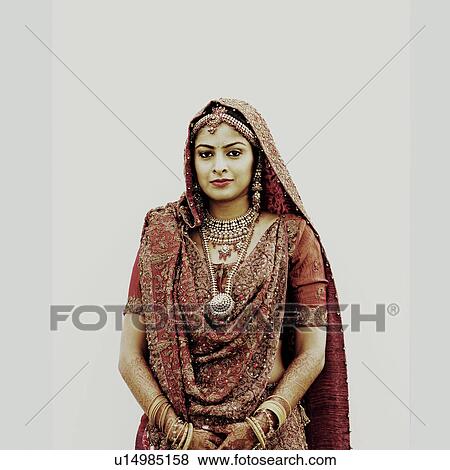 Stock Photo - Portrait of a bride in a traditional wedding dress. Fotosearch