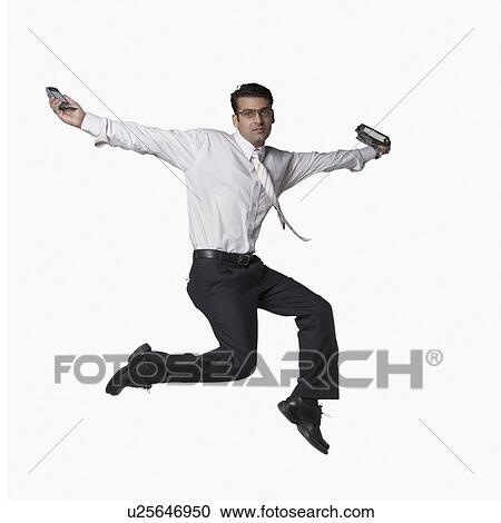 Stock Image - Portrait of a businessman jumping. Fotosearch