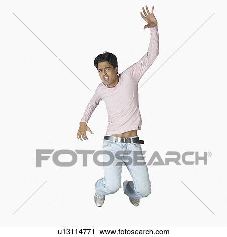 Portrait of a young man jumping View Large Photo Image Stock Image - Portrait of a young man jumping. Fotosearch