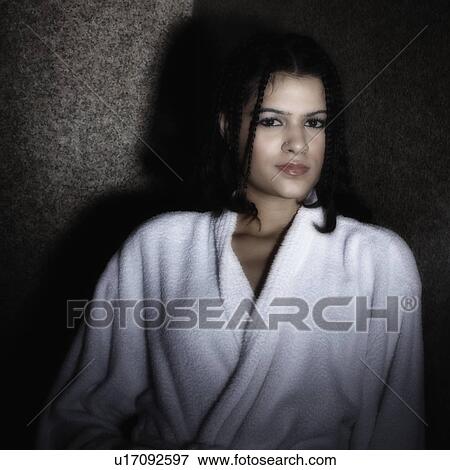 Stock Photo - Portrait of a young woman in a bathrobe. Fotosearch