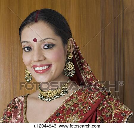 Stock Image - Portrait of a young woman smiling. Fotosearch