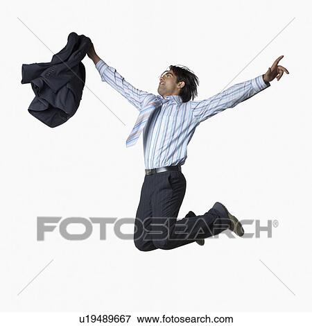 Side profile of a businessman holding his coat and jumping View Large Photo Image Stock Photo - Side profile of a businessman holding his coat and jumping. Fotosearch