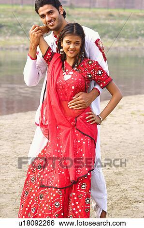 Stock Photograph - Portrait of a young couple posing. Fotosearch