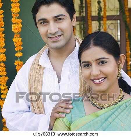 Portrait of a young couple smiling View Large Photo Image Stock Image - Portrait of a young couple smiling. Fotosearch