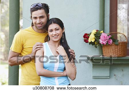 Portrait of a young couple smiling View Large Photo Image Stock Photo - Portrait of a young couple smiling. Fotosearch