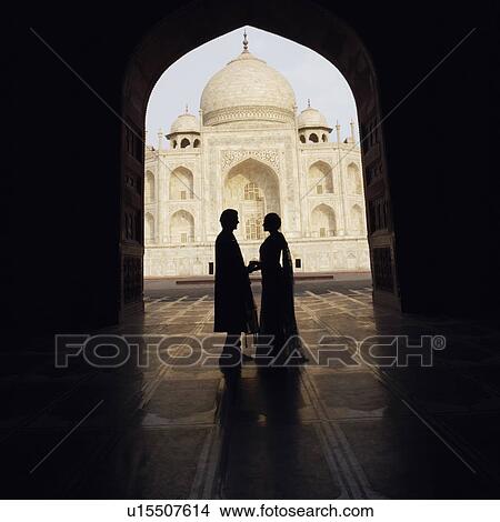 Silhouette of a couple standing in front of a mausoleum, Taj Mahal, Agra, Uttar Pradesh, India View Large Photo Image Picture - Silhouette of a couple standing in front of a mausoleum, Taj Mahal, Agra, Uttar Pradesh, India. Fotosearch