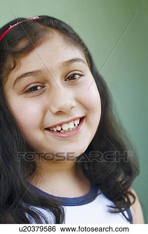 Stock Photograph - Portrait of a girl smiling. Fotosearch