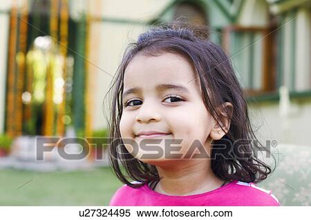 Portrait of a girl smirking View Large Photo Image Stock Photography - Portrait of a girl smirking. Fotosearch