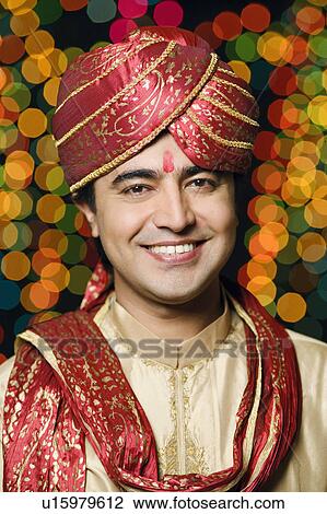 Stock Image - Portrait of a groom in a traditional wedding outfit. Fotosearch