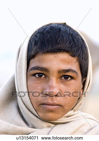 Portrait of a teenage boy wearing a shawl, Pushkar, Rajasthan, India View Large Photo Image Stock Image - Portrait of a teenage boy wearing a shawl, Pushkar, Rajasthan, India. Fotosearch