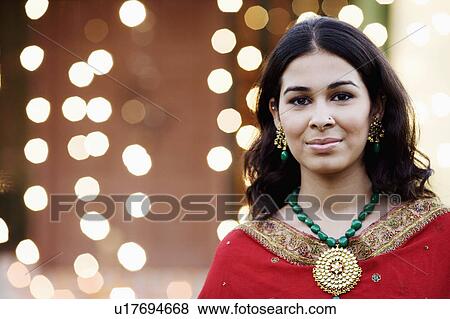 Stock Photo - Portrait of a young woman grinning. Fotosearch