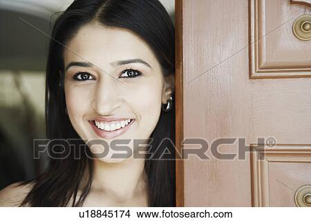 Picture - Portrait of a young woman smiling. Fotosearch