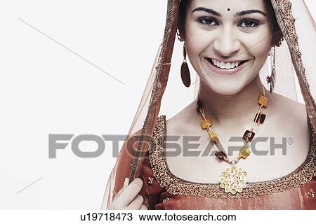 Portrait of a young woman in traditional clothing smiling View Large Photo Image Stock Image - Portrait of a young woman in traditional clothing smiling. Fotosearch
