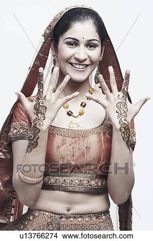 Portrait of a young woman with henna tattoo's on her hands View Large Photo Image Picture - Portrait of a young woman with henna tattoo's on her hands. Fotosearch