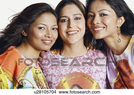 Portrait of three young women smiling View Large Photo Image Picture - Portrait of three young women smiling. Fotosearch