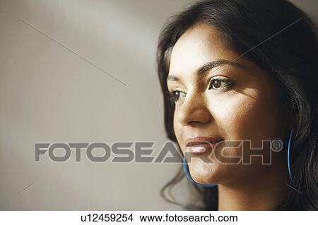 Picture - Close-up of a young woman smiling. Fotosearch