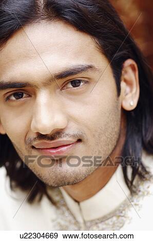 Stock Photo - Portrait of a young man smiling. Fotosearch
