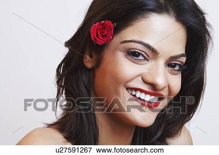Portrait of a young woman smiling View Large Photo Image Stock Photo - Portrait of a young woman smiling. Fotosearch