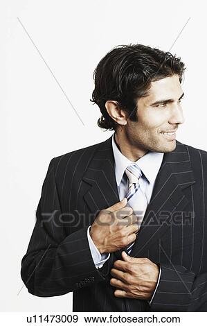 Close-up of a businessman smiling View Large Photo Image Stock Photo - Close-up of a businessman smiling. Fotosearch