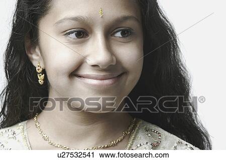Close-up of a girl smiling View Large Photo Image Stock Image - Close-up of a girl smiling. Fotosearch