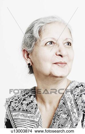 Picture - Close-up of a mature woman looking up. Fotosearch