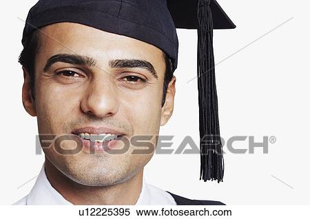 Stock Photography - Portrait of a male graduate smiling. Fotosearch