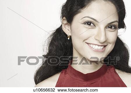 Stock Image - Portrait of a young woman smiling. Fotosearch