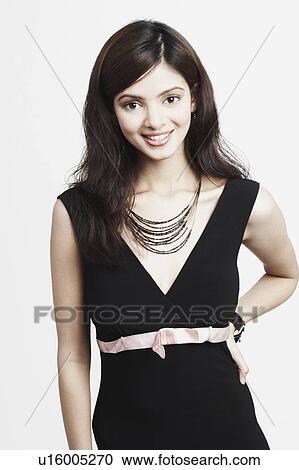 Stock Image - Portrait of a young woman smiling. Fotosearch
