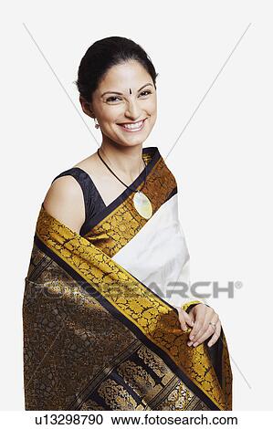 Portrait of a young woman wearing a sari View Large Photo Image Stock Image - Portrait of a young woman wearing a sari. Fotosearch