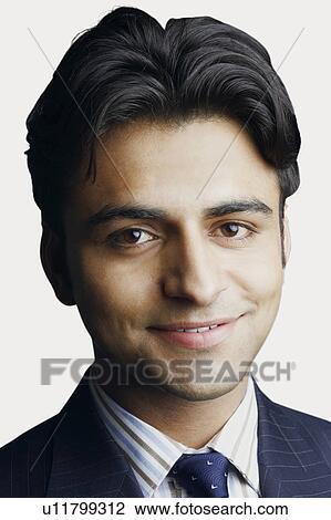 Portrait of a businessman smiling View Large Photo Image Stock Image - Portrait of a businessman smiling. Fotosearch