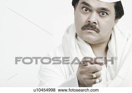 Portrait of a mature man pointing forward View Large Photo Image Stock Photo - Portrait of a mature man pointing forward. Fotosearch