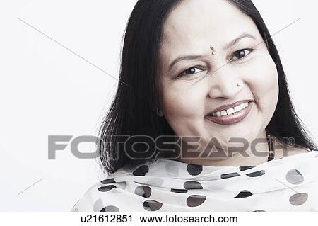 Portrait of a mature woman smiling View Large Photo Image Stock Image - Portrait of a mature woman smiling. Fotosearch