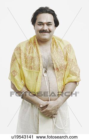 Stock Image - Portrait of a priest smiling. Fotosearch